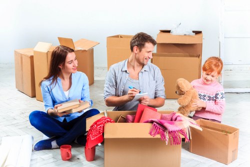 Relocation professionals setting up office furniture after a move
