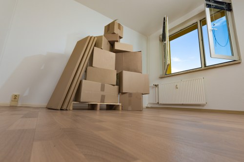 Packed office equipment and furniture prepared for local relocation