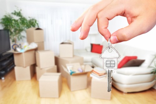 Professional removals team packing and loading household items