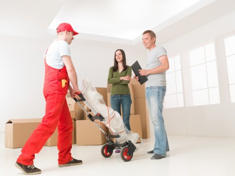 Local moving truck loading furniture for a house move