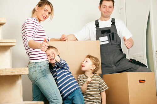 Furniture and boxes being loaded into a removal van